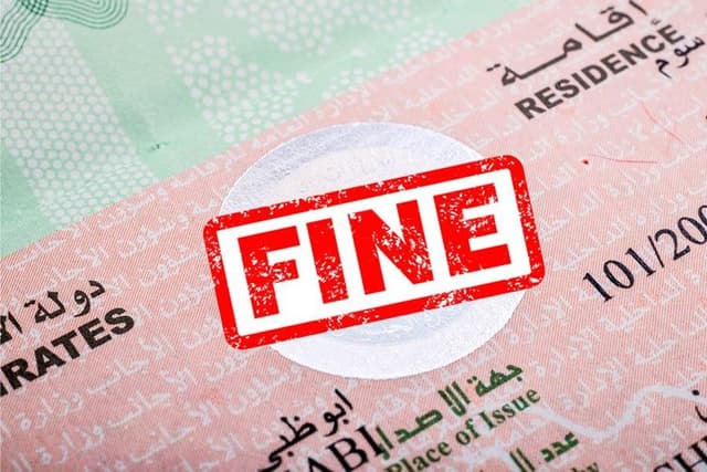 Fine stamp with residence visa in the background